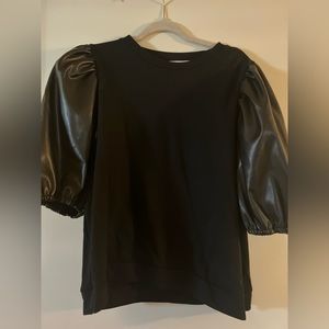 Black dressy top with faux leather puffy short sleeves.